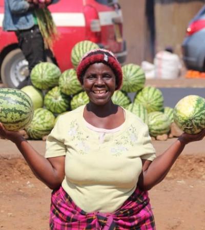 A widowed woman selling watermelon on the road side in Malawi Image: Global Fund for Widows